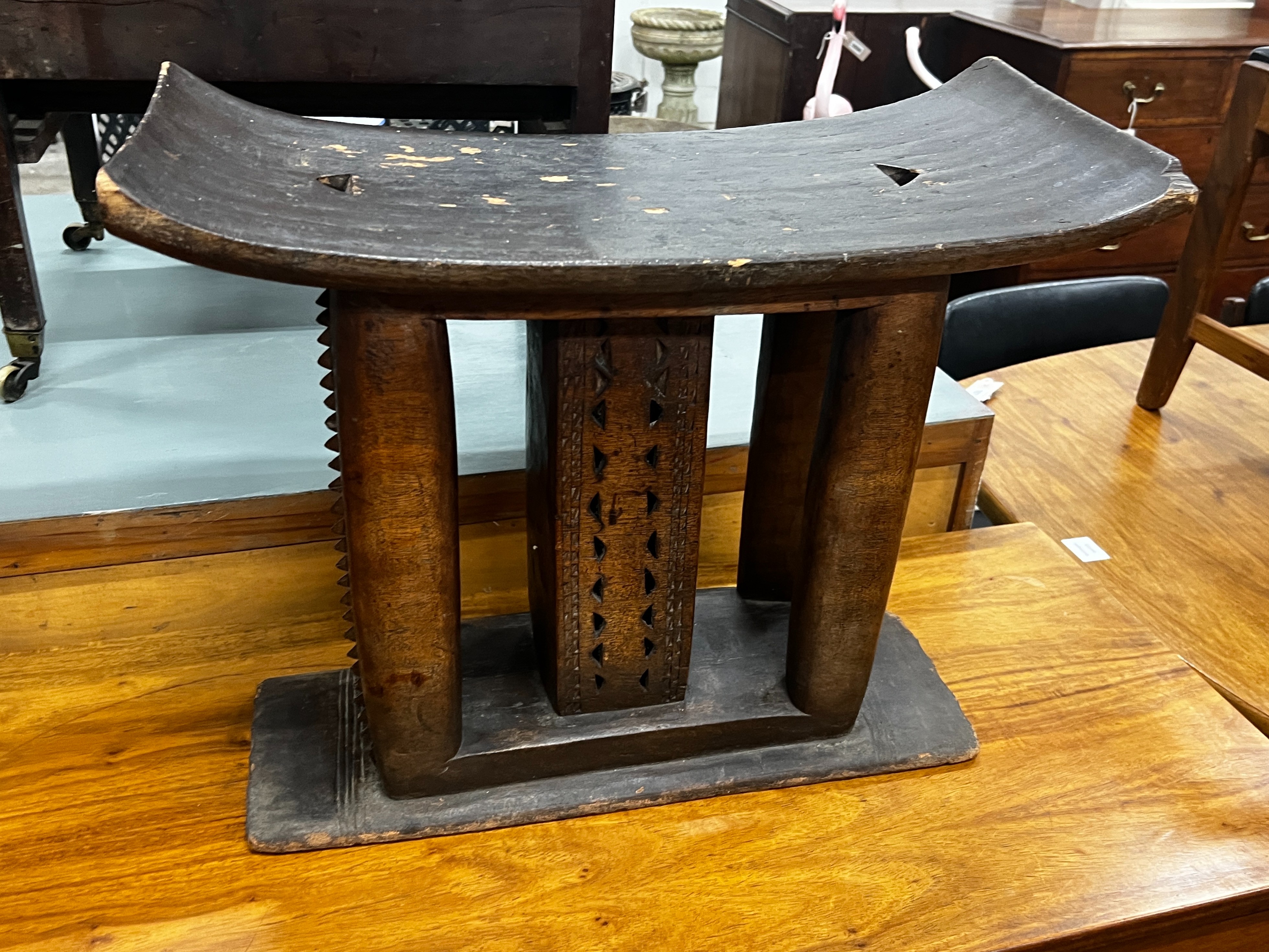 Two African chip carved stools, larger width 56cm, height 47cm